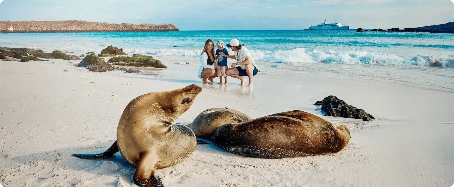 Family with sea lion in Galapagos Islands