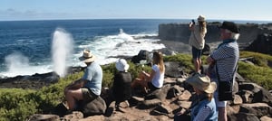 Suarez Point - Española in Galapagos Island, tourist looking the sea
