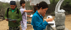 Post Office - Floreana Island in the Galapagos, tourist writing letters