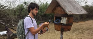 Post Office - Floreana Island in the Galapagos, tourist showing letters