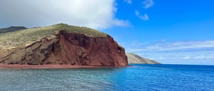 Rabida in Galapagos Islands, view of the red hill with tourist looking around