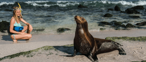 Cerro Brujo - San Cristobal in Galapagos Islands, tourist walking in the beach and watching the sea