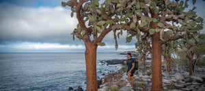 A traveler at the Santa Fe Island`s beach