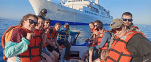 Galapagos activities: Travelers in a Panga going to the Galapagos Legend Cruise