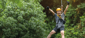Ecuador Land Tours - A person doing canopy in one of our expeditions