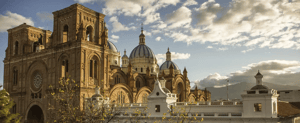 The New Cathedral of Cuenca, Ecuador, with its iconic blue domes and colonial architecture.